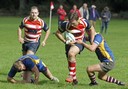 Alex Stronach with ball being supported by Marc Higgins